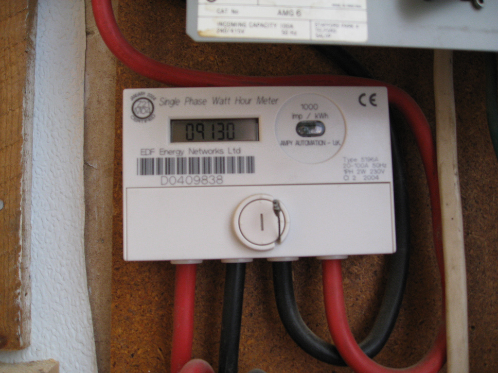 Fixed digital electricity meter with an LCD reading and its surrounding casing